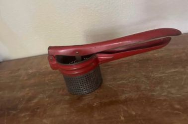 Antique potato presser