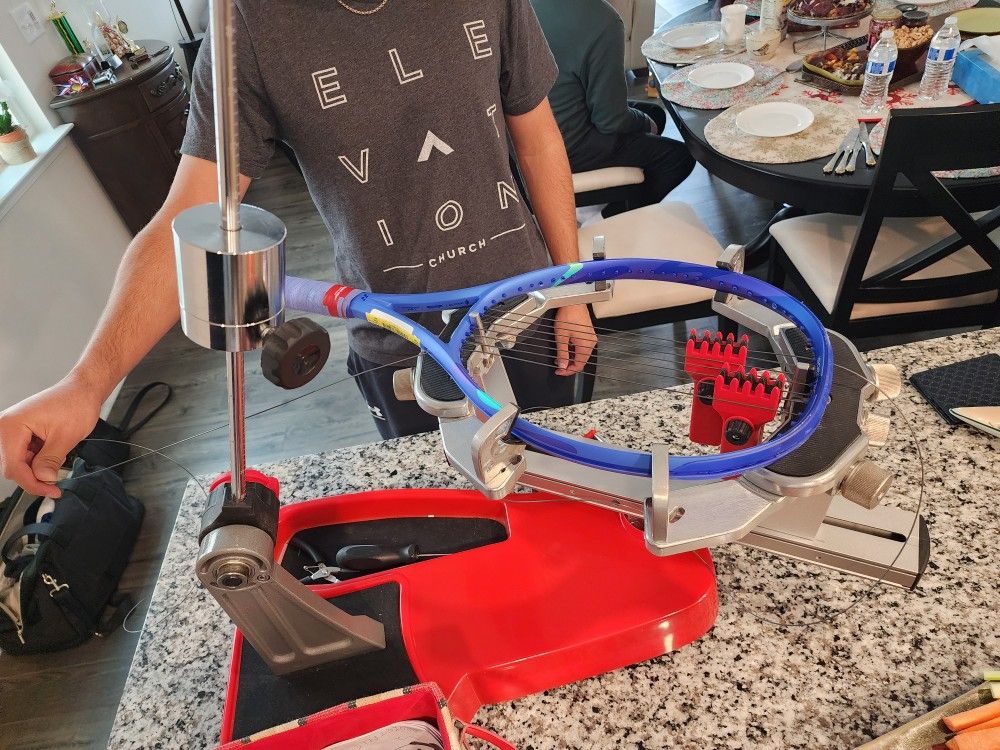 TENNIS RACKET STRINGING