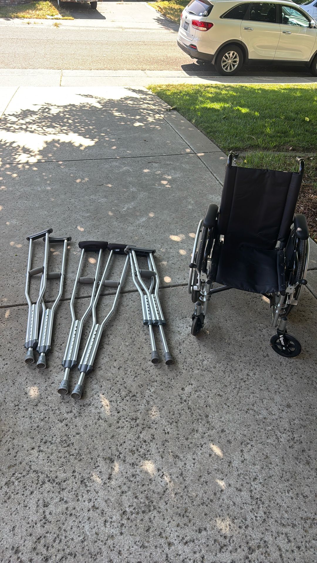 Kids Wheel Chair And Crutches,  And Two Pairs Of Adult Crutches  