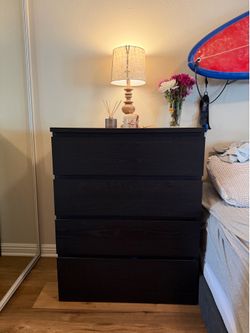 Black wood four drawer dresser
