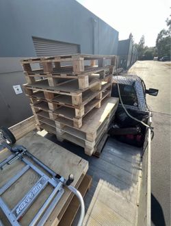 Pallets with plywood on top for sale