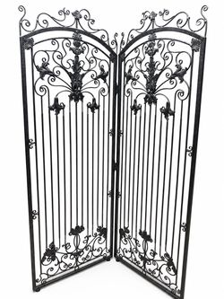 Large, ornate wrought-iron folding room divider
