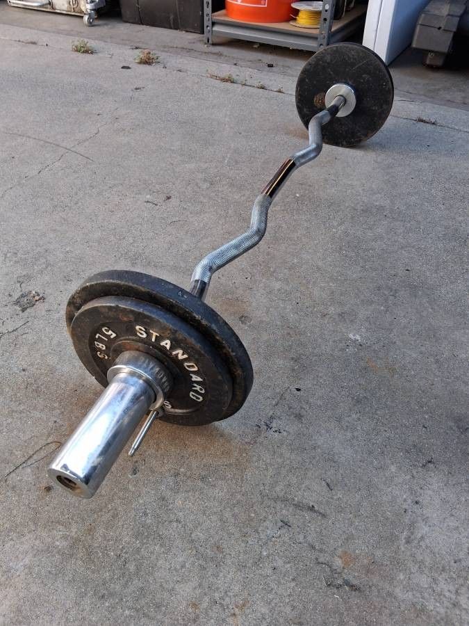 olympic barbell exercises with 30 lb weight plates - $80