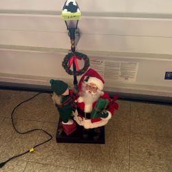 Santa Claus & Caroler Under Lamppost