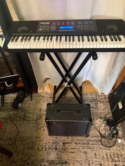 RockJam 61-Key electronic keyboard, likely the RJ761 or a similar model from one of their kits. These models are designed for beginners and come with 