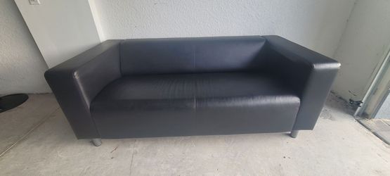Black faux-leather couch