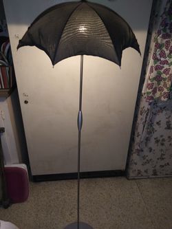 Gray floor lamp, with umbrella shade.