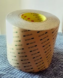3M 9495LE Adhesive Transfer Tape - 12 in. x 180 ft. Double Coated Polyester Tape Roll with 300LSE Laminating Adhesive. 
