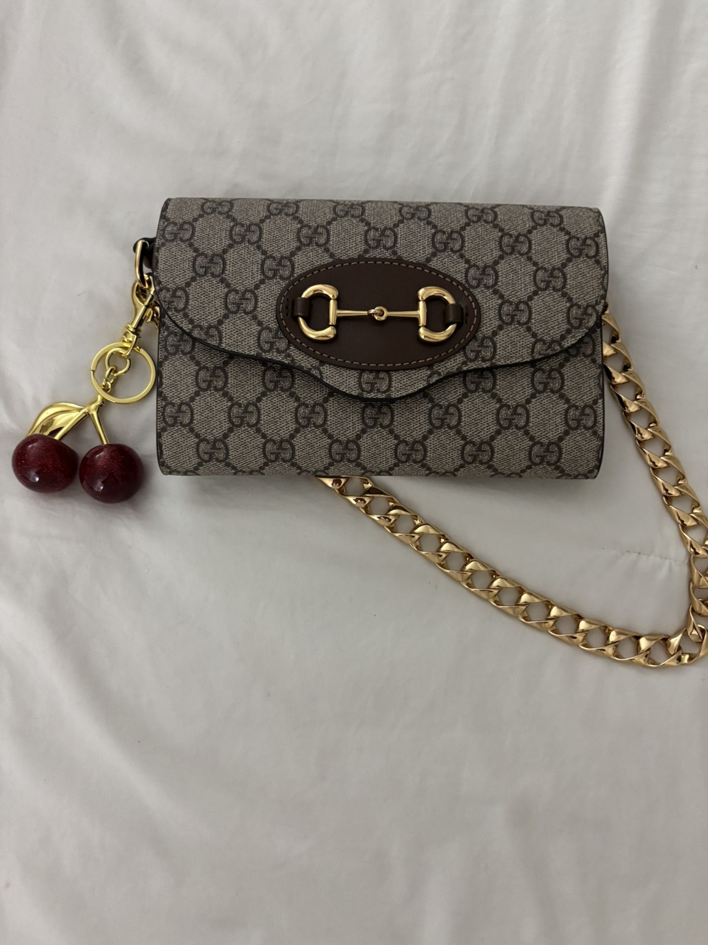 Gucci Brown And Gold Cluth With Monogram Design