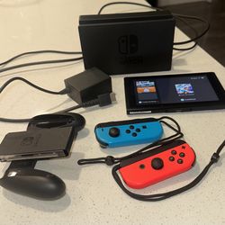 Nintendo Switch With Neon Blue And Neon Red Joy-Con