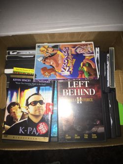 Over 500 DVD movies in cases three dollars to five dollars each