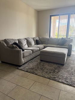 Ashley Furniture Gray Sectional Sofa with Matching Oversized Ottoman – Excellent Condition