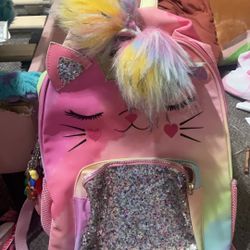 Unicorn kitty backpack with a a lot of keychains