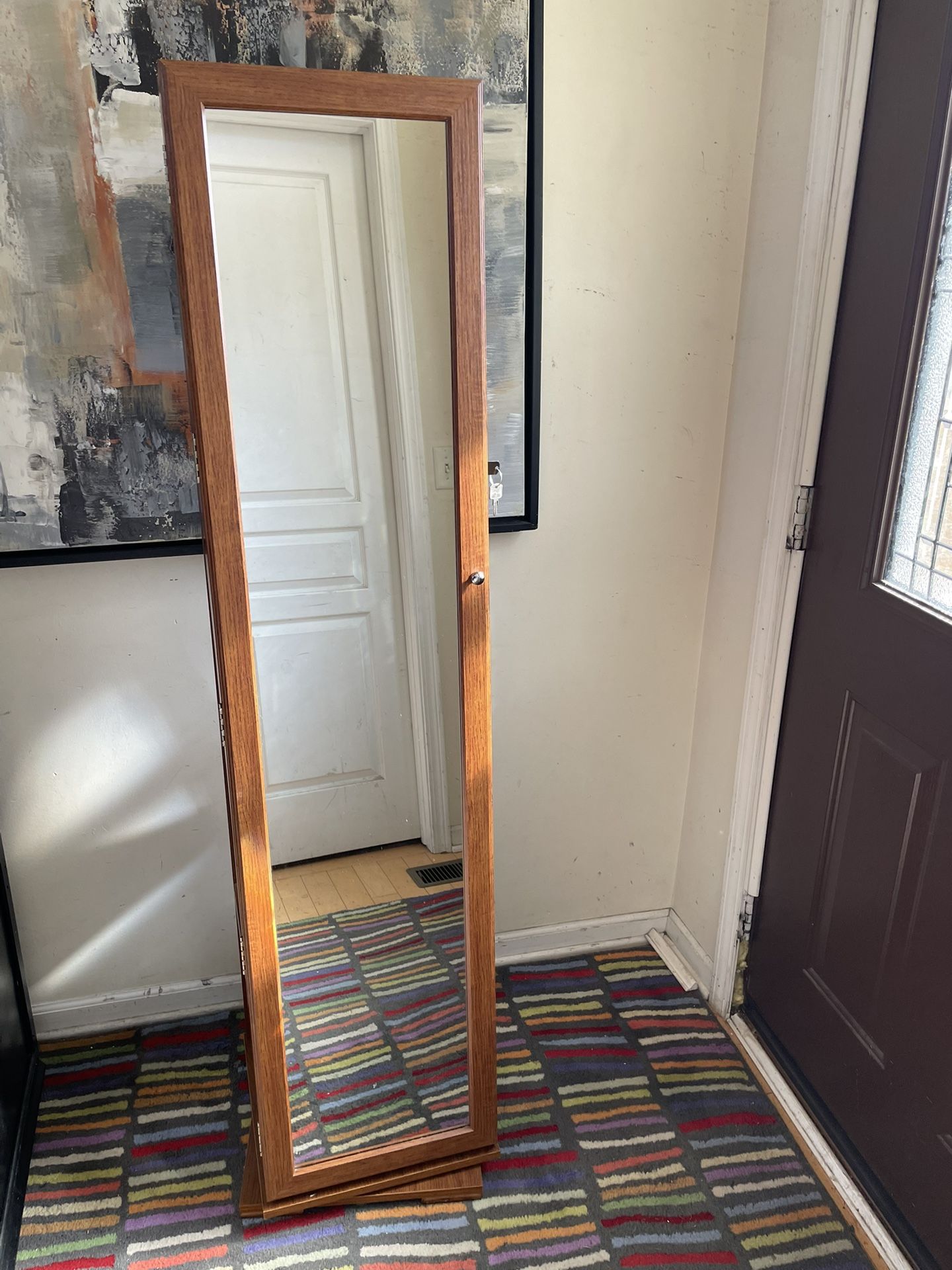 63.5” High Swivel Base Jewelry Armoire with Mirror
