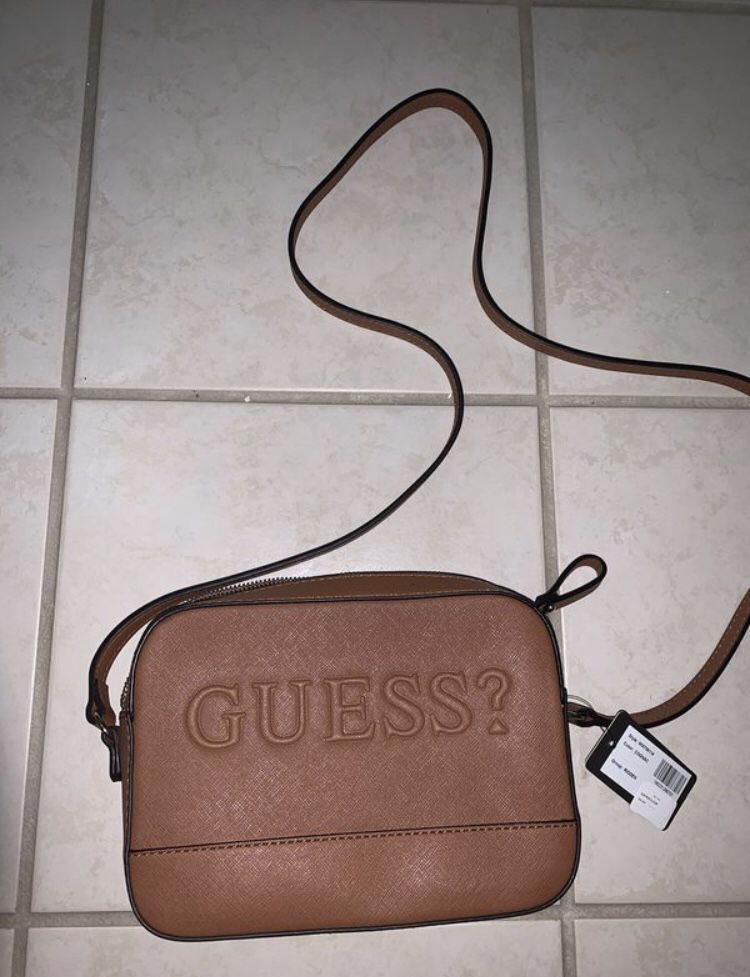 Guess handbag new with tag. Reg $49.99