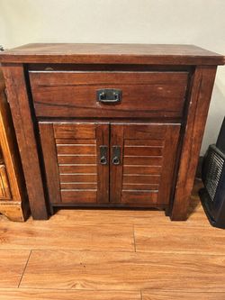 Rustic dark wood storage cabinet