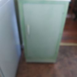 Antique Storage Cabinet With Metal Wheels 