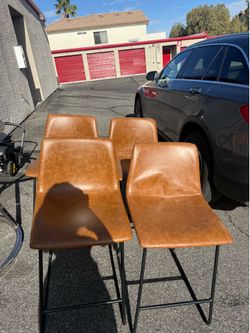 Brown real leather bar stools.