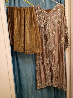 Salwar kameez is a traditional, versatile South Asian outfit consisting of a tunic (kameez), trous