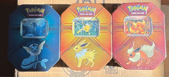 Pokemon tcg triple effect tins eeveeloutions 2017