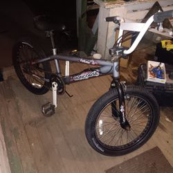 20-inch grey Mongoose Ravage BMX bike