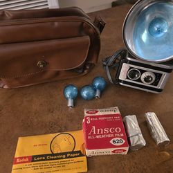 Vintage Kodak camera with film and flash