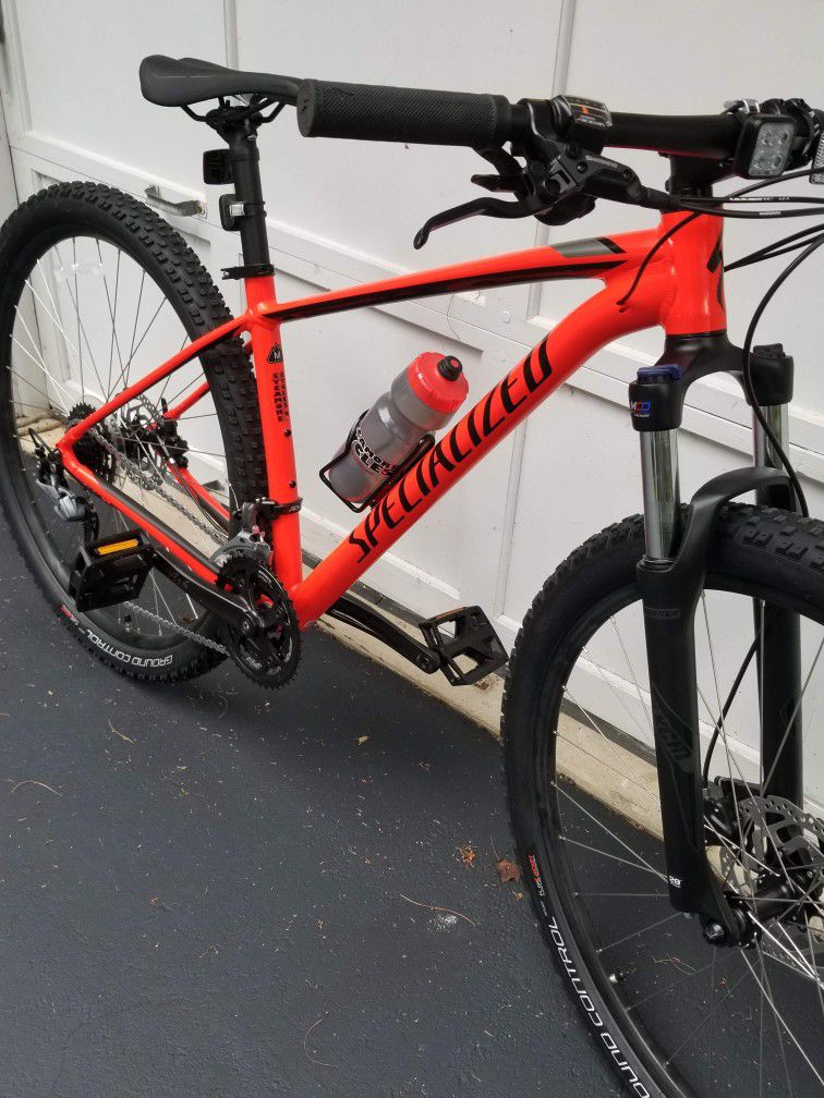 Specialized 29ers , Red is 2018, White is 2012