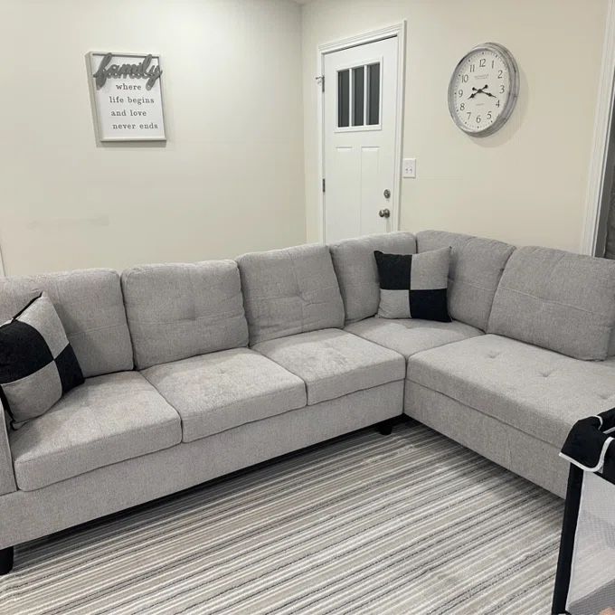 Light Gray Sectional Couch and Ottoman