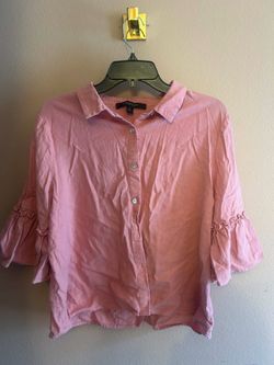 pink, short-sleeved button-down blouse