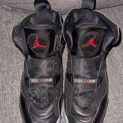 black and red Jordan Jumpman Two Trey sneakers.