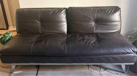 Dark brown leather futon couch w/ Working Outlets