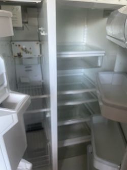 White Side-by-Side Refrigerator with Ice Dispenser not working