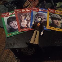 Beatles.4 BOoks/Magazines Dated 2003 And One Action Figure.All 4 Covers Change When Tilted Side To Side