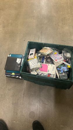 Tote Full Of cell Phone Cases And Some Tablet Cases For Electronics 