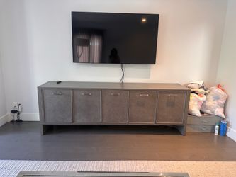 Custom gray sideboard media console with leather doors