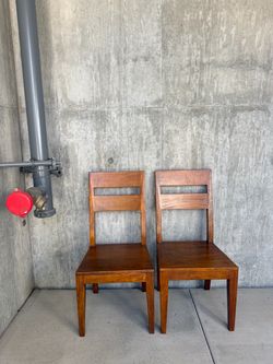 Two Crate and Barrel Wood chairs