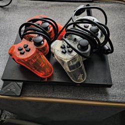 PS2 With Two Controllers And Games 
