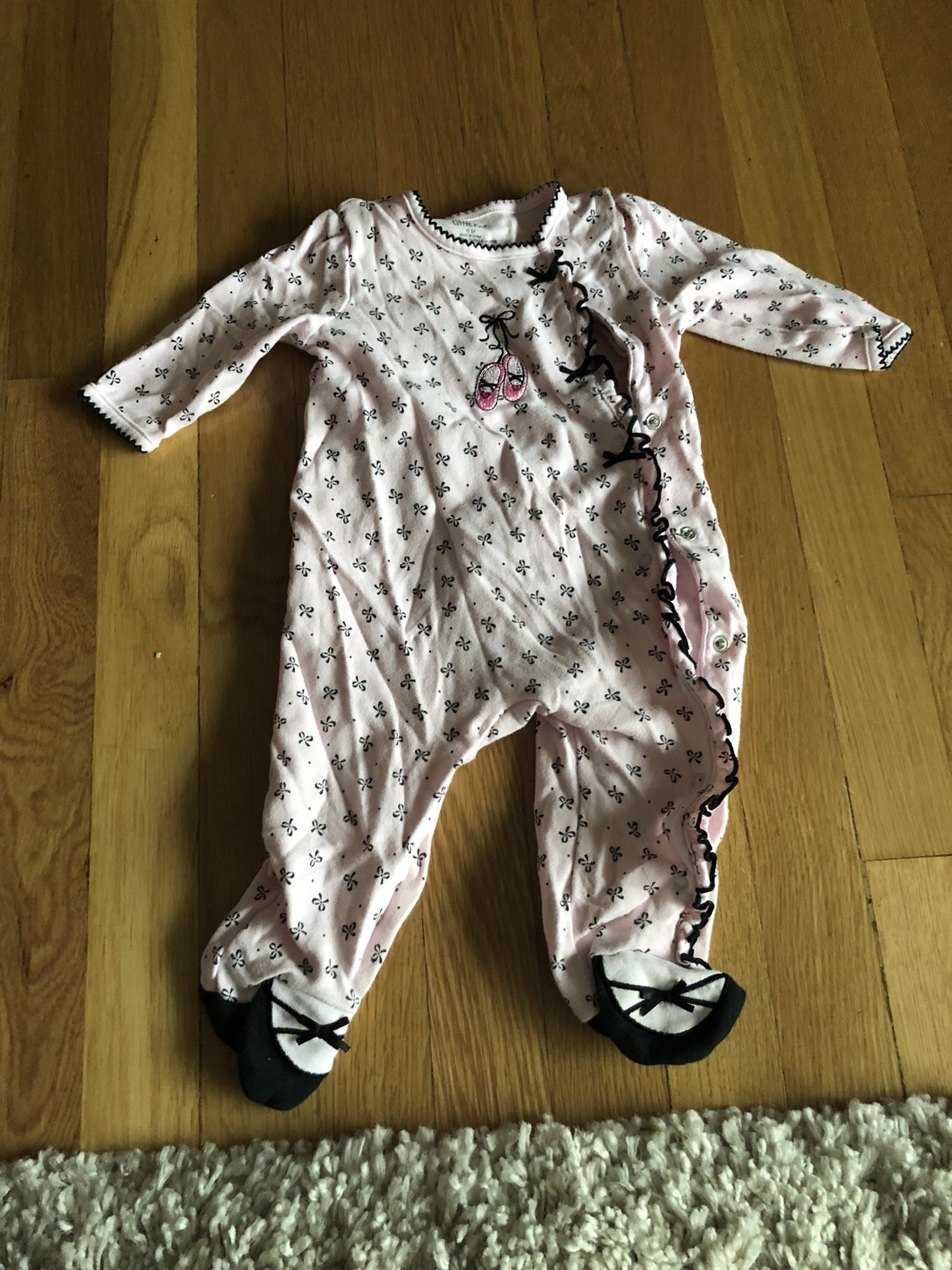 Little me brand: six month pajama or onesie outfit.