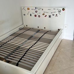 Two IKEA beds are disassembled and ready for assembly.