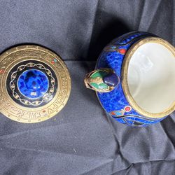 From the photos, this looks like an Egyptian-themed decorative lidded jar / trinket box featuring