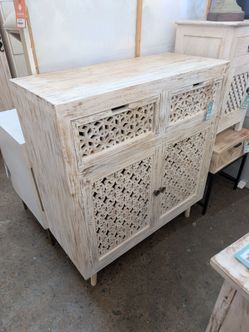Carved front two door cabinet