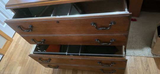 Really heavy, solid wood, filing cabinet.