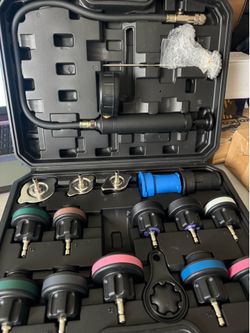 Universal radiator pressure test pump with adapters