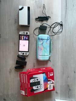 Nintendo switch OLED white with teal carrying case