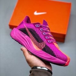 Pink Nike shoes designed by the designer