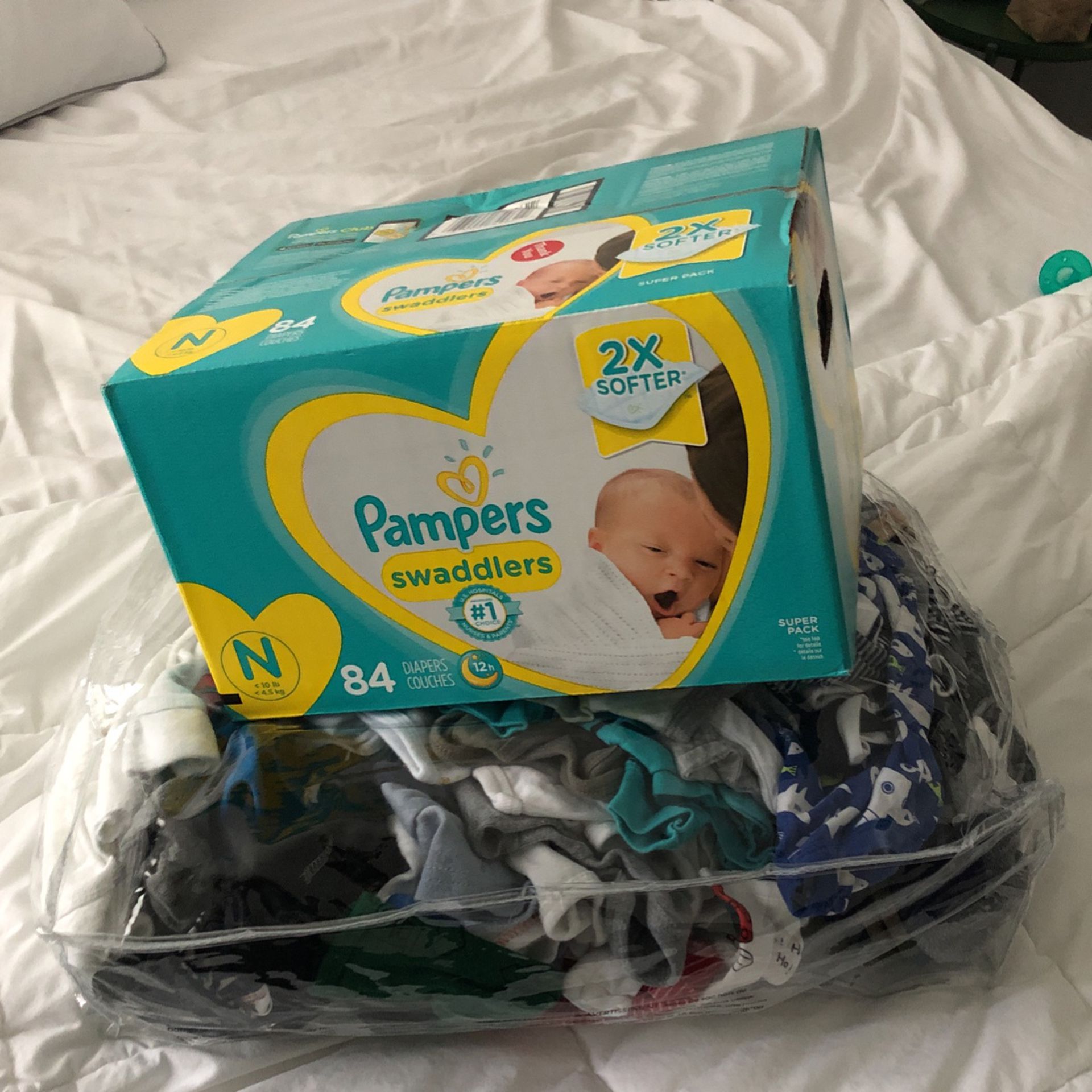 newborn clothes and diapers