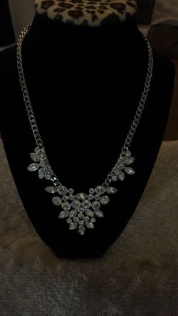 Givenchy silver-tone necklace featuring marquise-cut crystal embellishments and a V-shaped bib design.