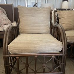 2 wicker and fabric chairs