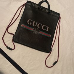 Black leather Gucci drawstring bag