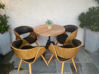 Round wood table with 4 designer chairs